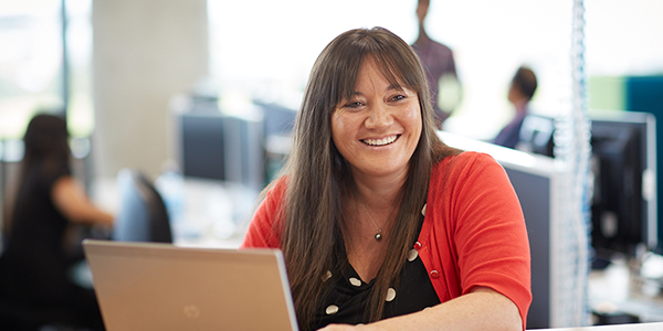 Why join Meridian laura 600 300 Meridian customer service representative smiling at her desk