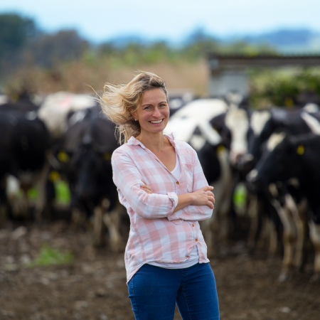 Female dairy farmer with cows