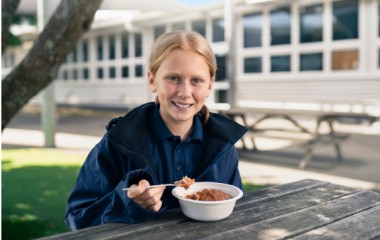 KidsCan child eating breakfast