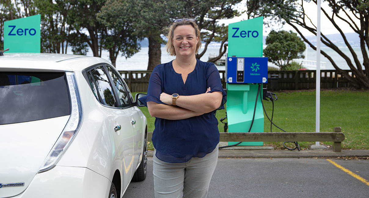 A person with a Nissan Leaf at Zero charging station