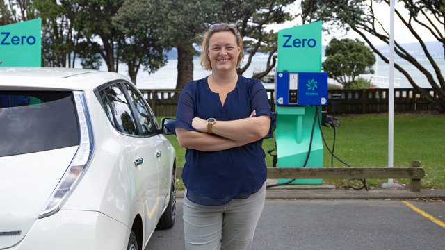 A person with a Nissan Leaf at Zero charging station