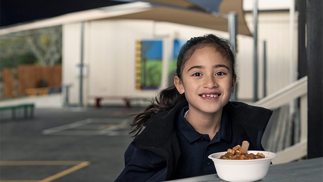 School girl eating lunch