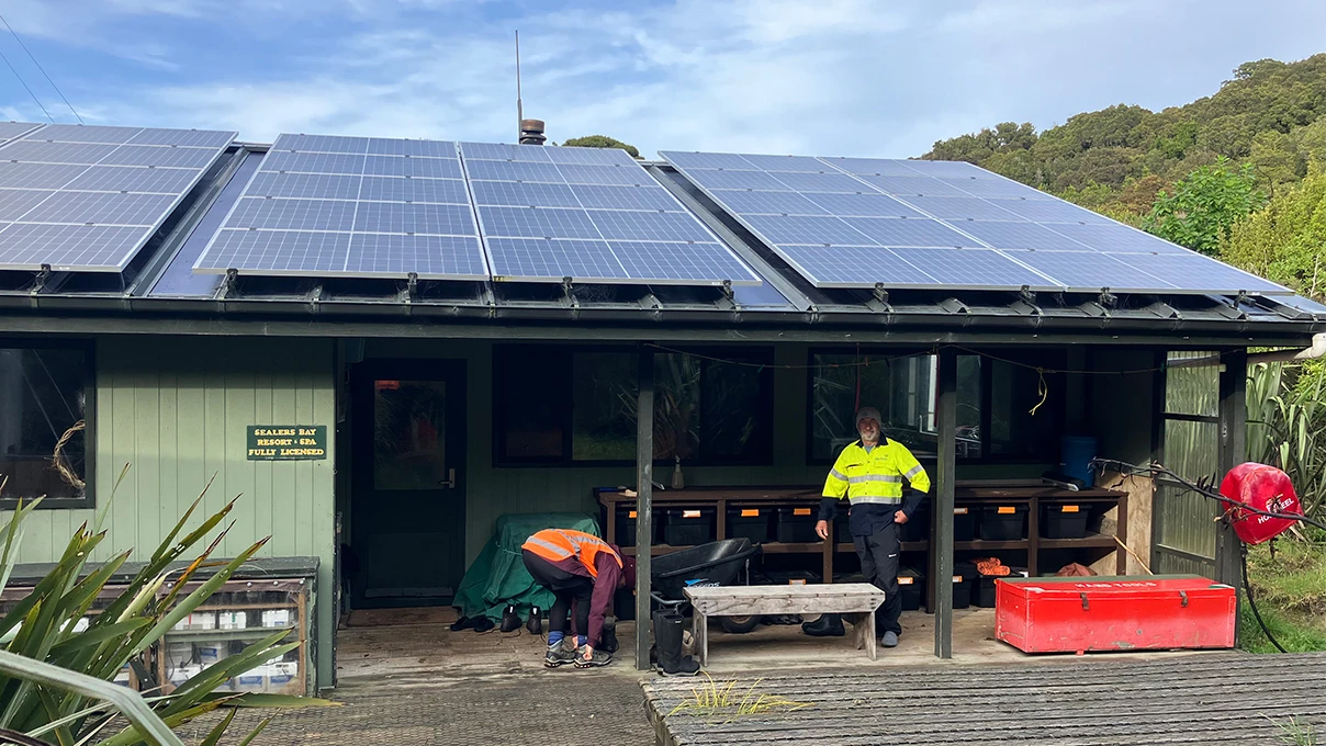 Meridian engineers by a DOC hut