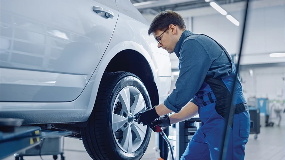 Person servicing a car
