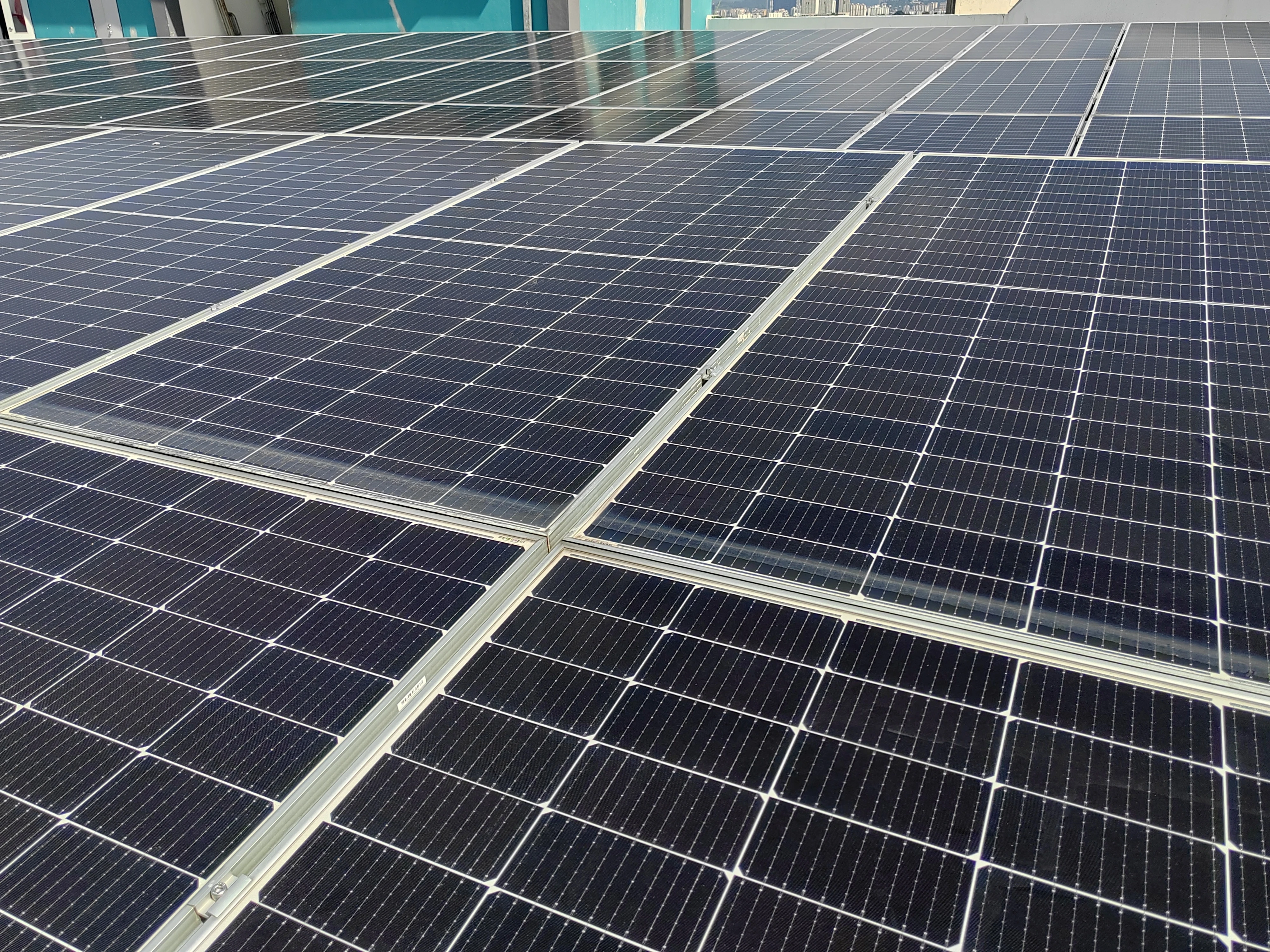 Close up of solar panels mounted to a roof.
