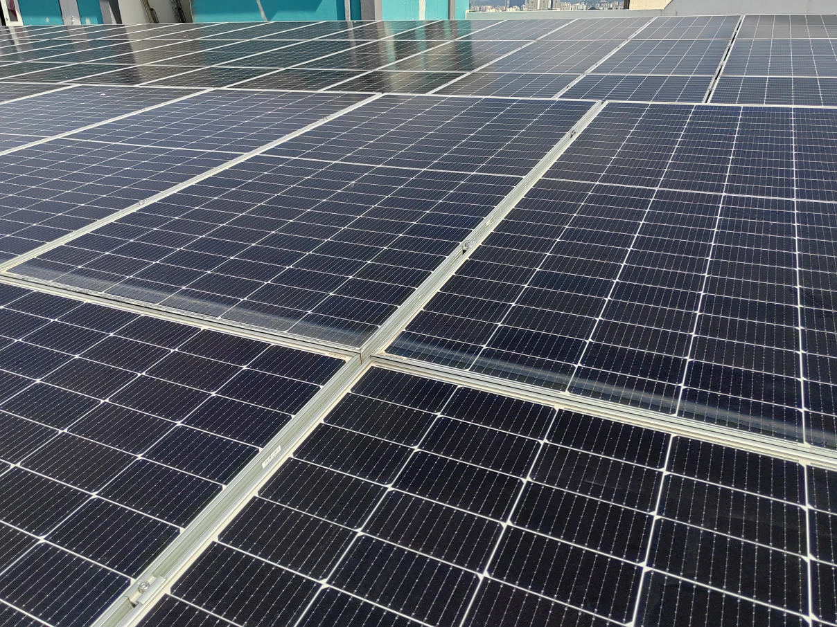 Close up of solar panels mounted to a roof.