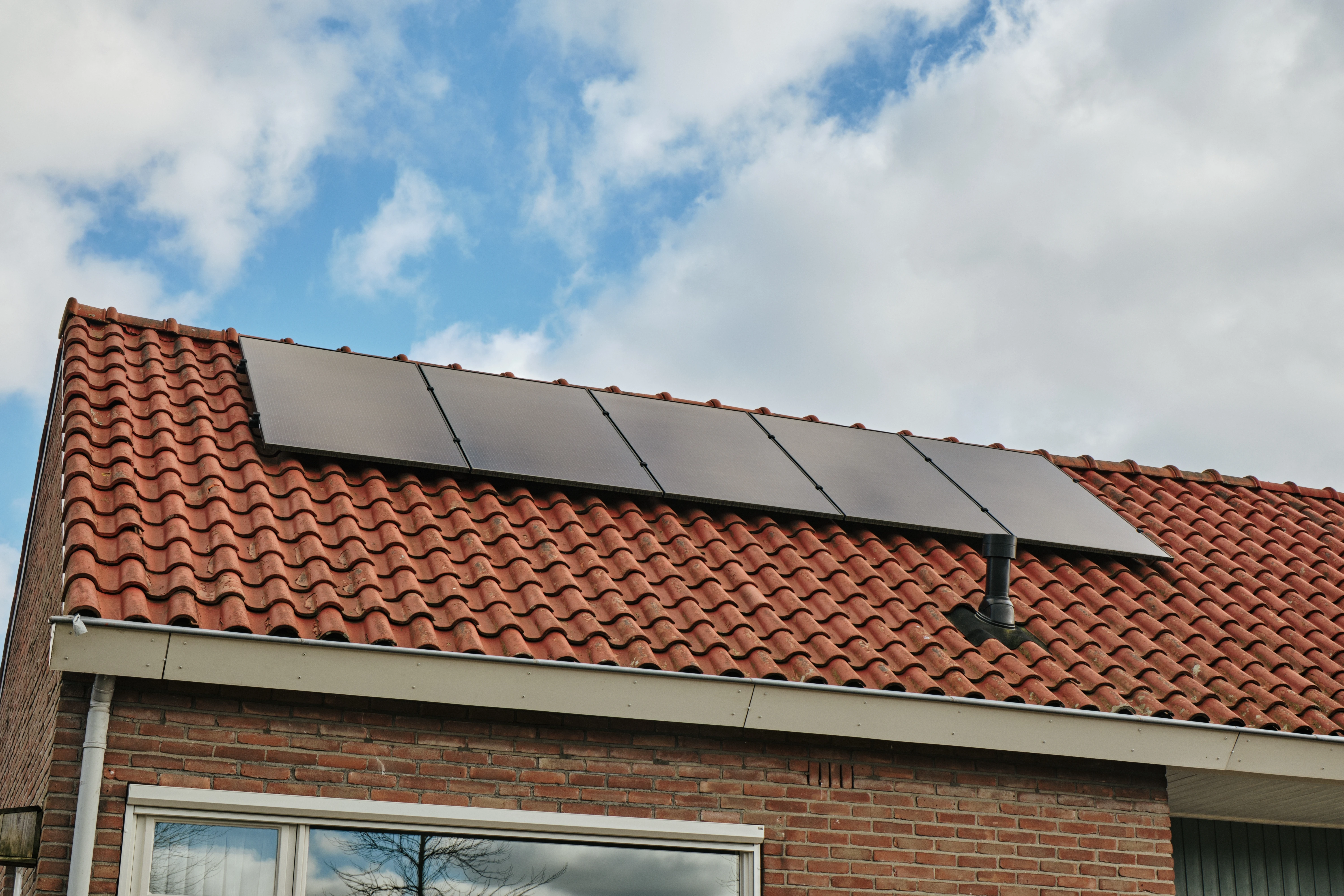 Residential home with solar panels on roof.