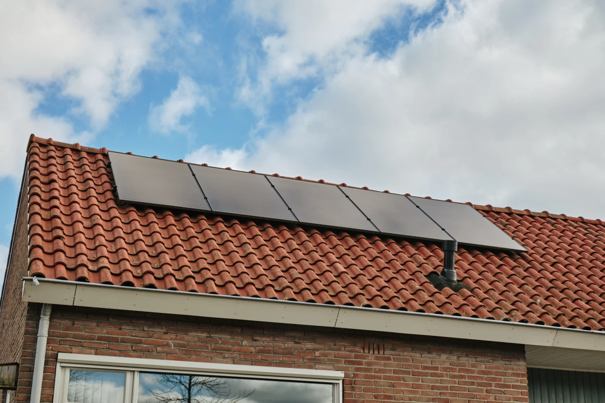 Residential home with solar panels on roof.